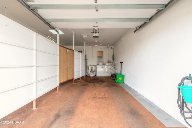 garage featuring washing machine and dryer