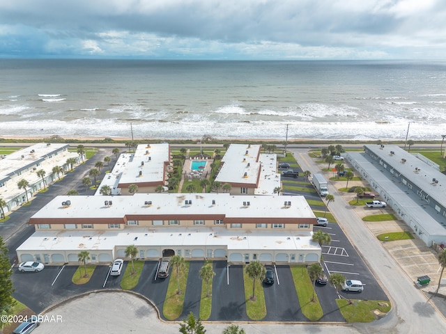 aerial view featuring a water view and a beach view