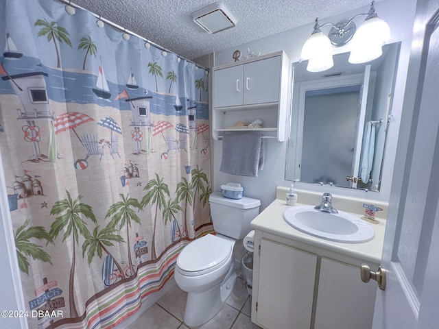 bathroom with tile patterned floors, vanity, a textured ceiling, curtained shower, and toilet