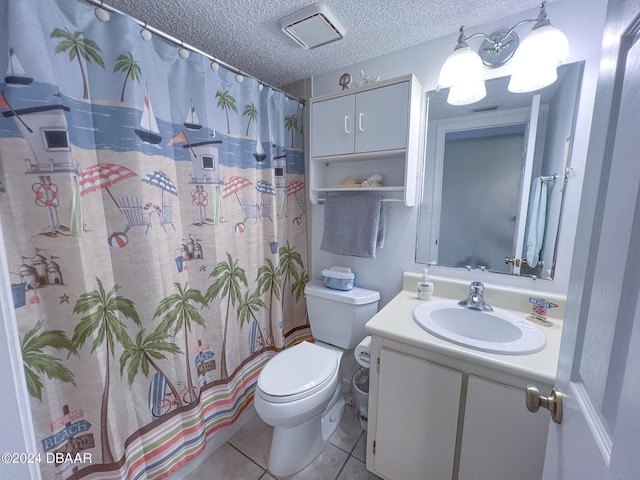 2700 Ocean Shore Blvd Unit 313, Ormond Beach, FL 32176 - full bath with vanity, a textured ceiling, a shower with shower curtain, and tile patterned floors