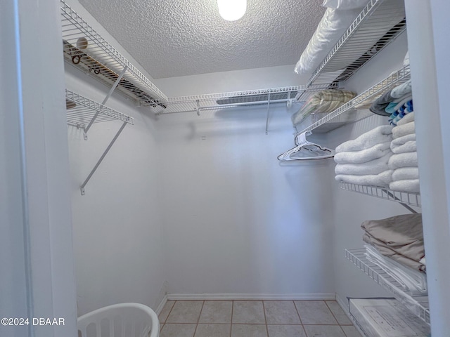 2700 Ocean Shore Blvd Unit 313, Ormond Beach, FL 32176 - walk in closet with light tile patterned flooring