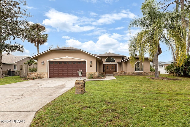 ranch-style house with a garage, cooling unit, and a front yard