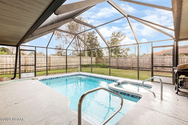 view of pool featuring a patio, a yard, a lanai, and an in ground hot tub