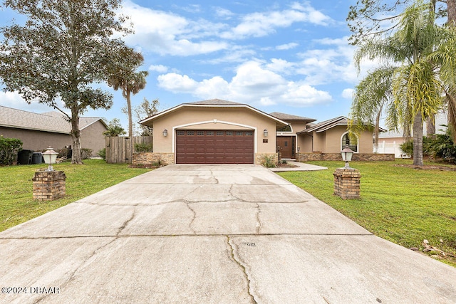 ranch-style home featuring a garage and a front yard