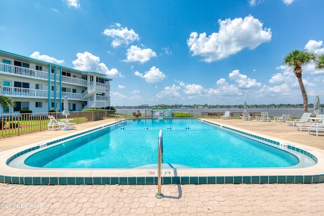 view of swimming pool with a patio