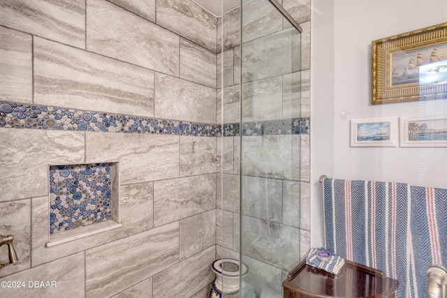 bathroom with tiled shower