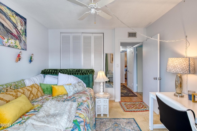 bedroom featuring ceiling fan and a closet