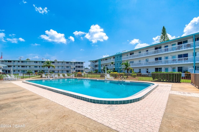 view of swimming pool with a patio area