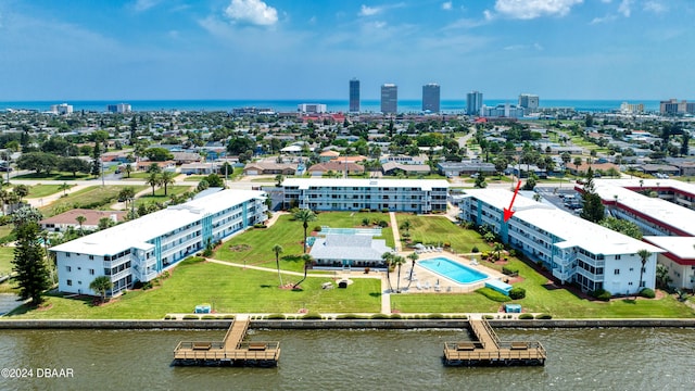 birds eye view of property with a water view