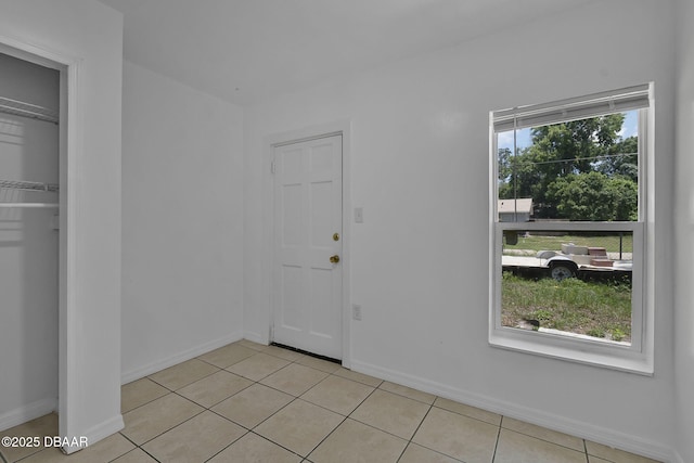 1214 Flomich St, Daytona Beach, FL 32117 - foyer entrance with light tile patterned floors and baseboards