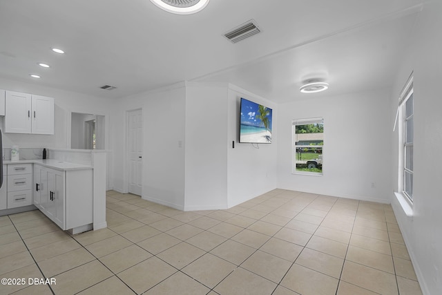 1214 Flomich St, Daytona Beach, FL 32117 - empty room with light tile patterned flooring and recessed lighting
