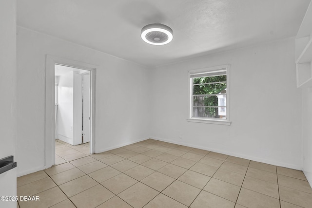 1214 Flomich St, Daytona Beach, FL 32117 - unfurnished room featuring light tile patterned floors and baseboards