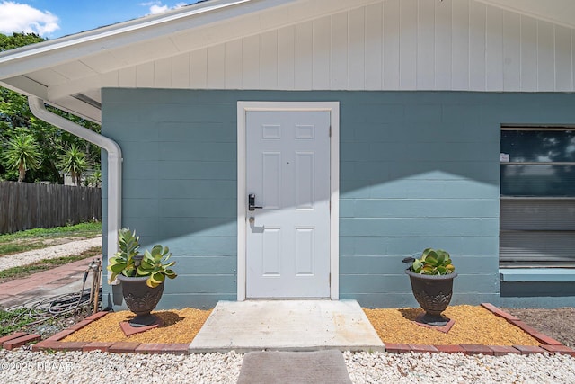 1214 Flomich St, Daytona Beach, FL 32117 - view of exterior entry featuring concrete block siding