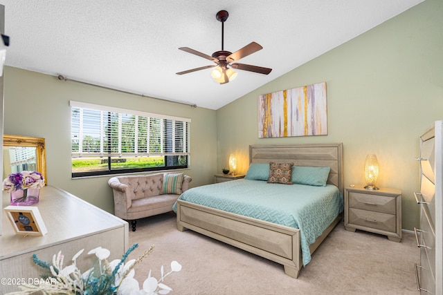 bedroom with vaulted ceiling, ceiling fan, and carpet floors