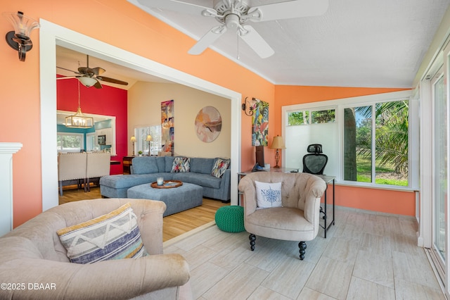 interior space with a ceiling fan and lofted ceiling