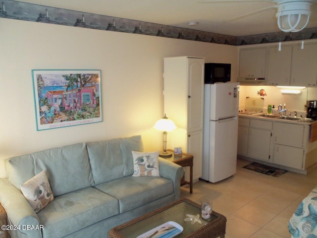 tiled living room featuring sink