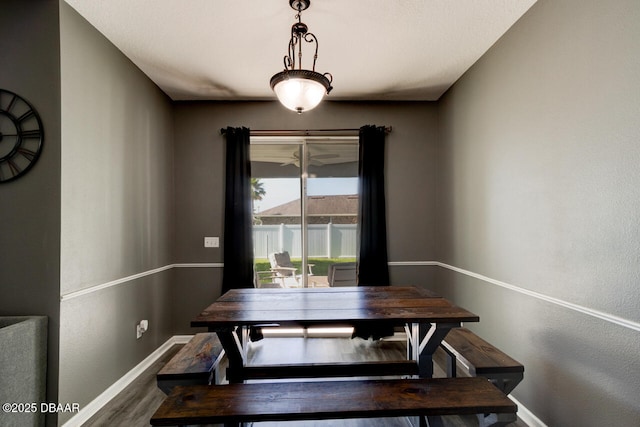 dining room with wood-type flooring