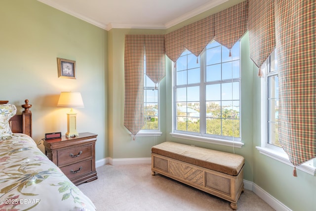 bedroom with ornamental molding and light carpet