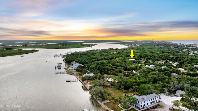 aerial view at dusk with a water view