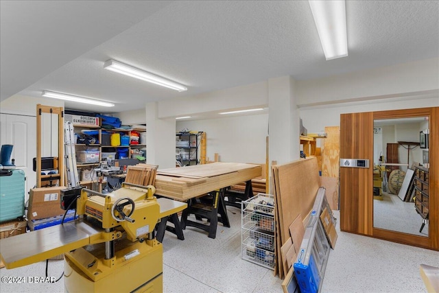 basement with a textured ceiling