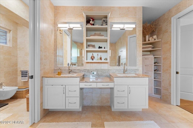 bathroom featuring tile walls, a bidet, tile patterned floors, and vanity