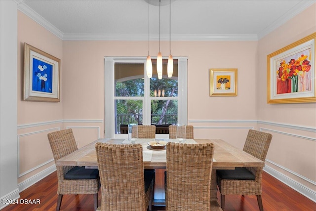 dining space with dark wood-type flooring and crown molding