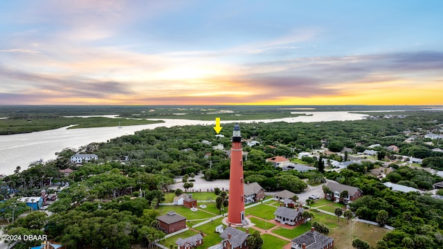 aerial view at dusk with a water view