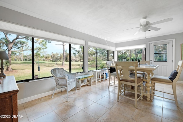 sunroom / solarium featuring ceiling fan