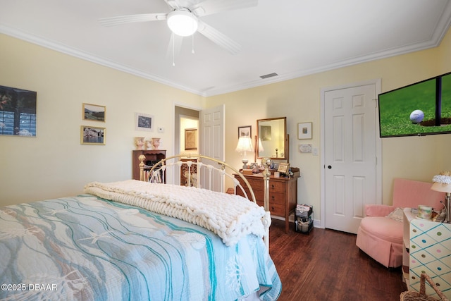 bedroom featuring crown molding, dark wood-type flooring, and ceiling fan