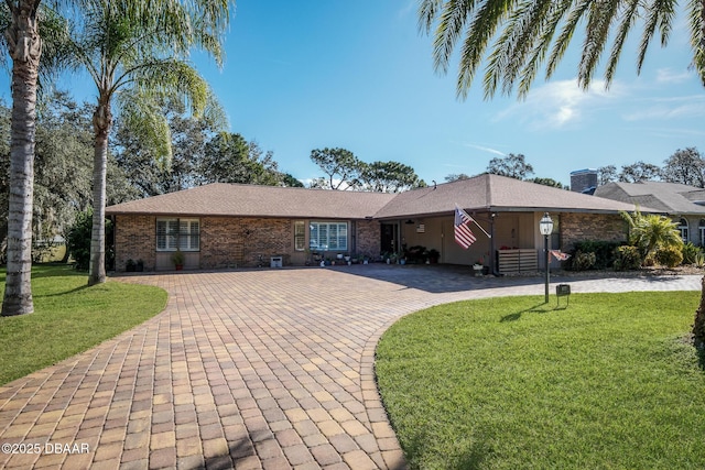 ranch-style house with a front lawn