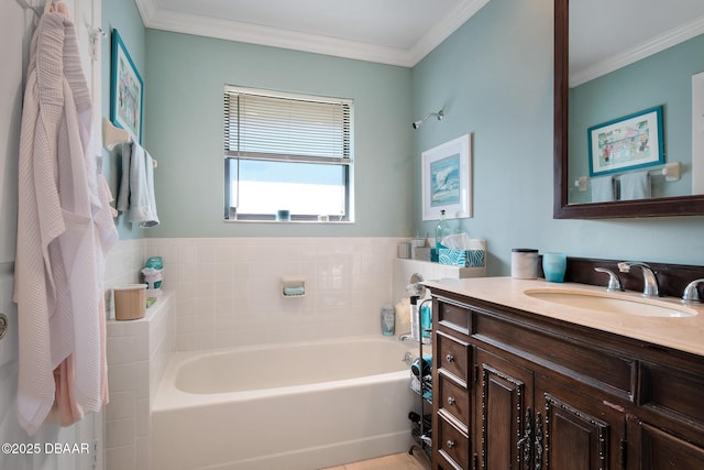 bathroom with crown molding, vanity, and a bath