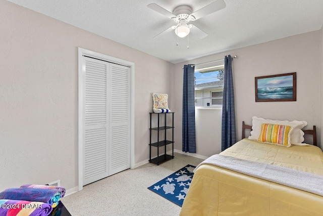 bedroom with ceiling fan and a closet