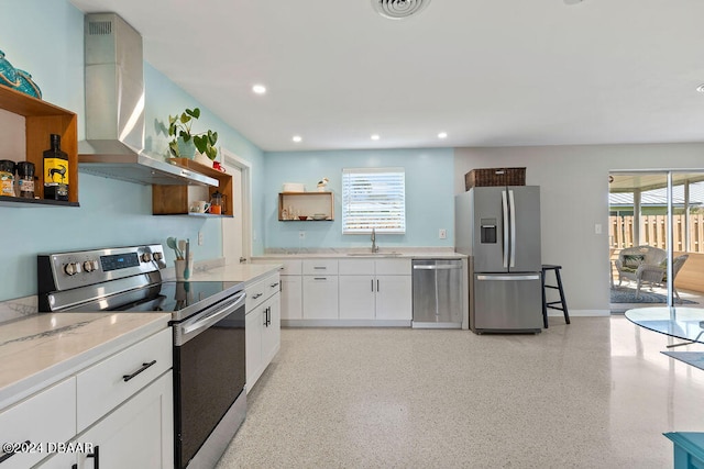 kitchen featuring stainless steel appliances, white cabinetry, and a healthy amount of sunlight