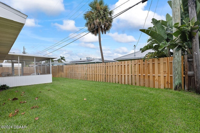 view of yard with a sunroom