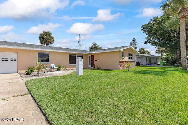 ranch-style house featuring a garage and a front yard