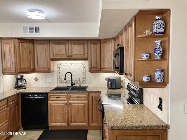 3580 S Ocean Shore Blvd Unit 905, Flagler Beach, FL 32136 - kitchen featuring black appliances, open shelves, brown cabinetry, decorative backsplash, and stone countertops