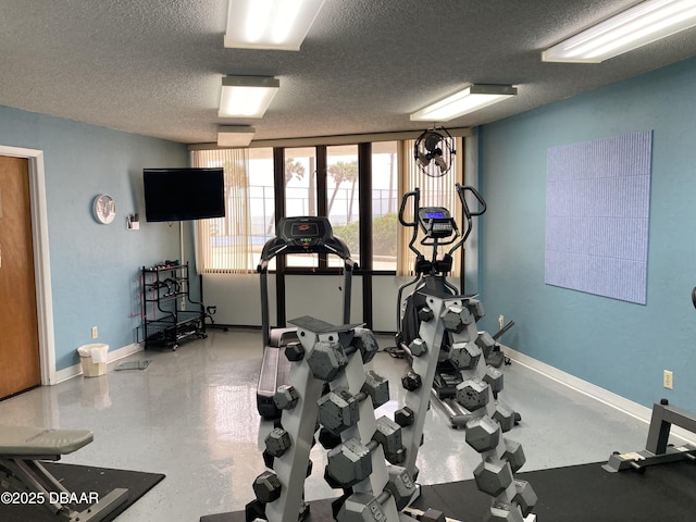 3580 S Ocean Shore Blvd Unit 905, Flagler Beach, FL 32136 - workout area with a textured ceiling and baseboards
