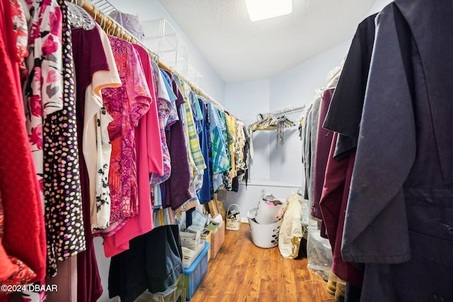 spacious closet featuring hardwood / wood-style flooring