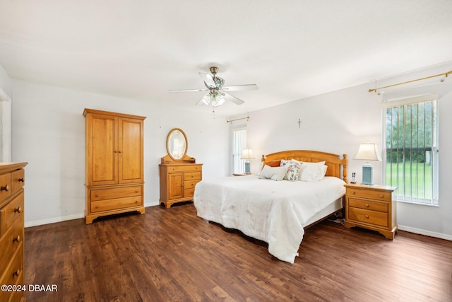 bedroom featuring ceiling fan and dark wood-type flooring