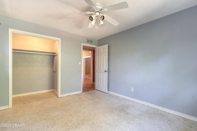 unfurnished bedroom featuring ceiling fan, a closet, and a textured ceiling