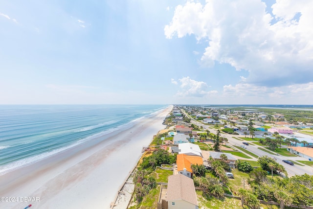 bird's eye view featuring a beach view and a water view