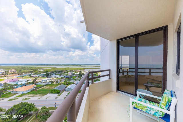 balcony featuring a water view