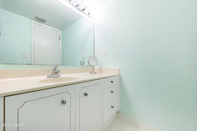 bathroom featuring tile patterned flooring and vanity