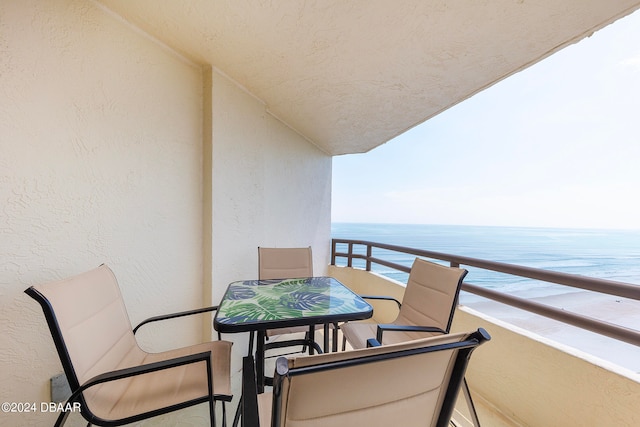 balcony featuring a water view