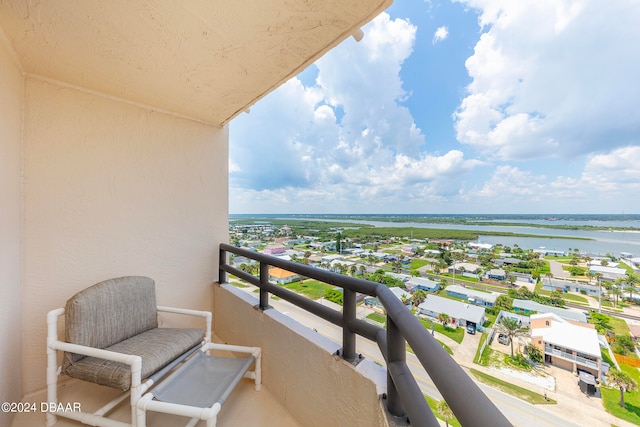 balcony featuring a water view