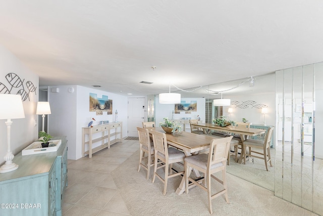 3855 S Atlantic Ave Unit 1206B, Daytona Beach Shores, FL 32118 - dining room with light tile patterned flooring