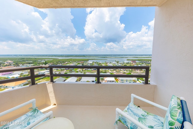 balcony featuring a water view