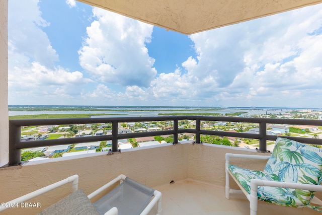 balcony with a view of the beach and a water view