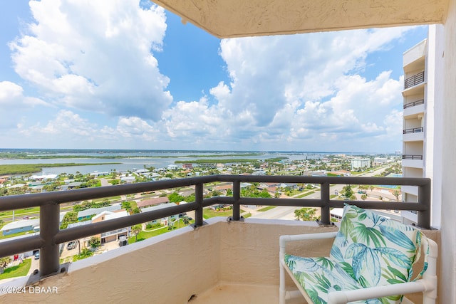 balcony featuring a water view