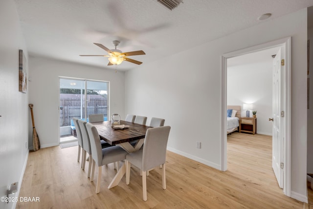 805 Spruce St, New Smyrna Beach, FL 32168 - dining room with light wood-style floors and a ceiling fan